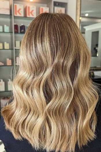 Warm Golden Blonde Waves on a woman with blonde hair, back view.